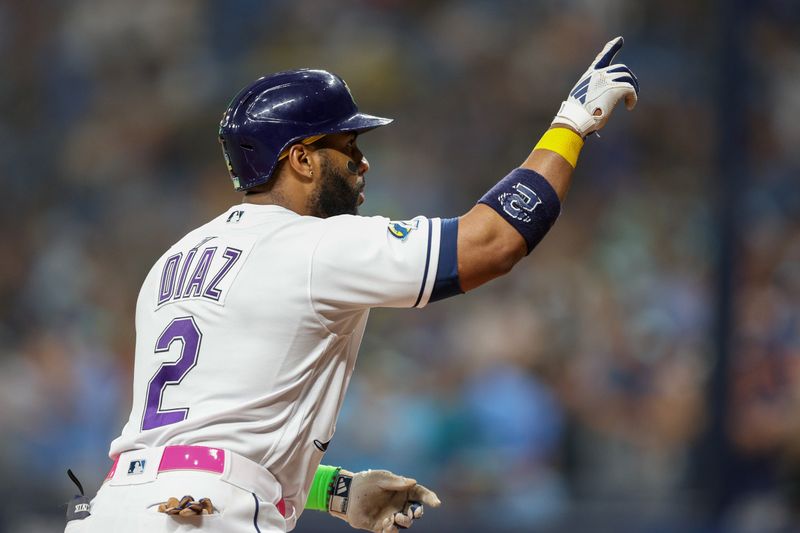 May 26, 2023; St. Petersburg, Florida, USA;  Tampa Bay Rays first baseman Yandy Diaz (2) celebrates after hitting a home run against the Los Angeles Dodgers in the fourth inning at Tropicana Field. Mandatory Credit: Nathan Ray Seebeck-USA TODAY Sports