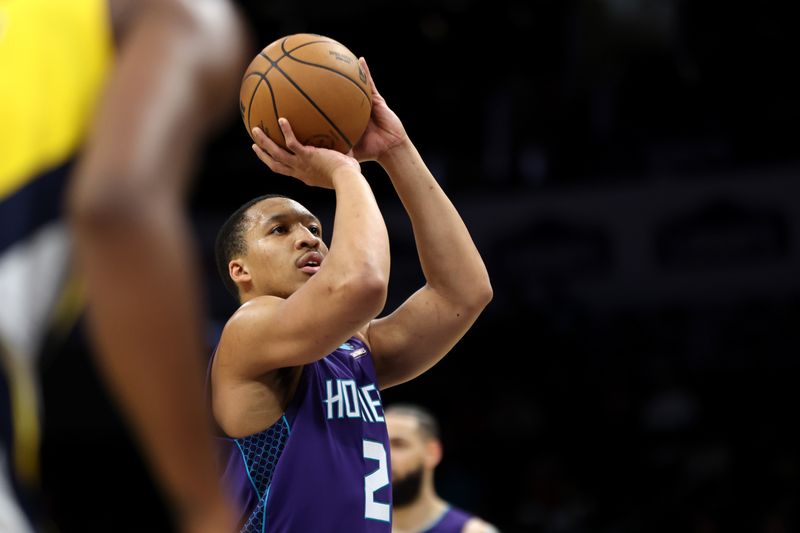 CHARLOTTE, NORTH CAROLINA - FEBRUARY 12: Grant Williams #2 of the Charlotte Hornets shoots a free throw during the first half of an NBA game against the Indiana Pacers at Spectrum Center on February 12, 2024 in Charlotte, North Carolina. NOTE TO USER: User expressly acknowledges and agrees that, by downloading and or using this photograph, User is consenting to the terms and conditions of the Getty Images License Agreement. (Photo by David Jensen/Getty Images)