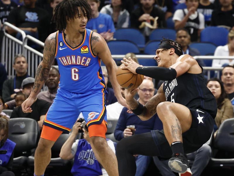 ORLANDO, FLORIDA - JANUARY 04: Paolo Banchero #5 of the Orlando Magic looks to pass the ball in the game against the Oklahoma City Thunder during the first quarter at Amway Center on January 04, 2023 in Orlando, Florida. NOTE TO USER: User expressly acknowledges and agrees that, by downloading and or using this photograph, User is consenting to the terms and conditions of the Getty Images License Agreement. (Photo by Douglas P. DeFelice/Getty Images)