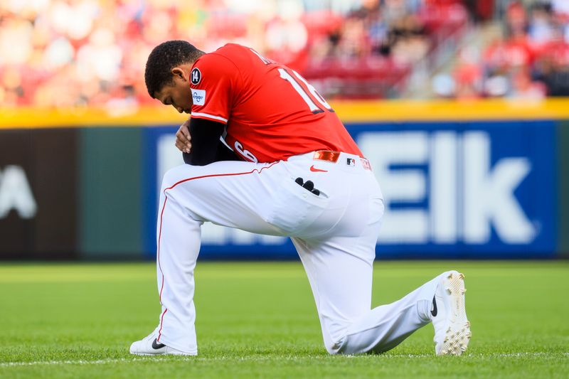 Apr 12, 2025; Cincinnati, Ohio, USA; Cincinnati Reds third baseman Noelvi Marte (16) kneels before the game against the Pittsburgh Pirates at Great American Ball Park. Mandatory Credit: Katie Stratman-Imagn Images