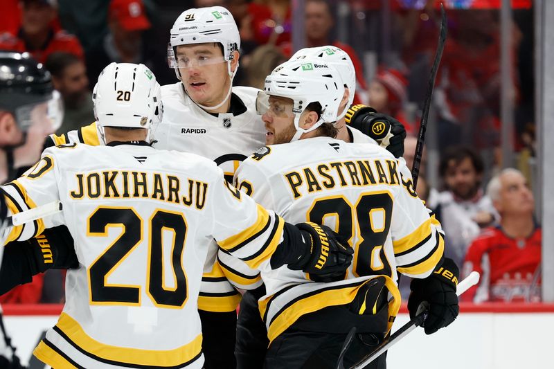 Oct 8, 2025; Washington, District of Columbia, USA; Boston Bruins right wing David Pastrnak (88) celebrates with teammates after scoring a goal against the Washington Capitals during the second period at Capital One Arena. Mandatory Credit: Geoff Burke-Imagn Images