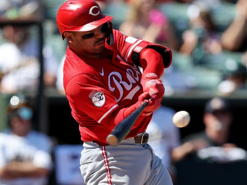 Sep 14, 2025; West Sacramento, California, USA; Cincinnati Reds catcher Jose Trevino (35) hits a single against the Athletics during the fourth inning at Sutter Health Park. Mandatory Credit: Dennis Lee-Imagn Images