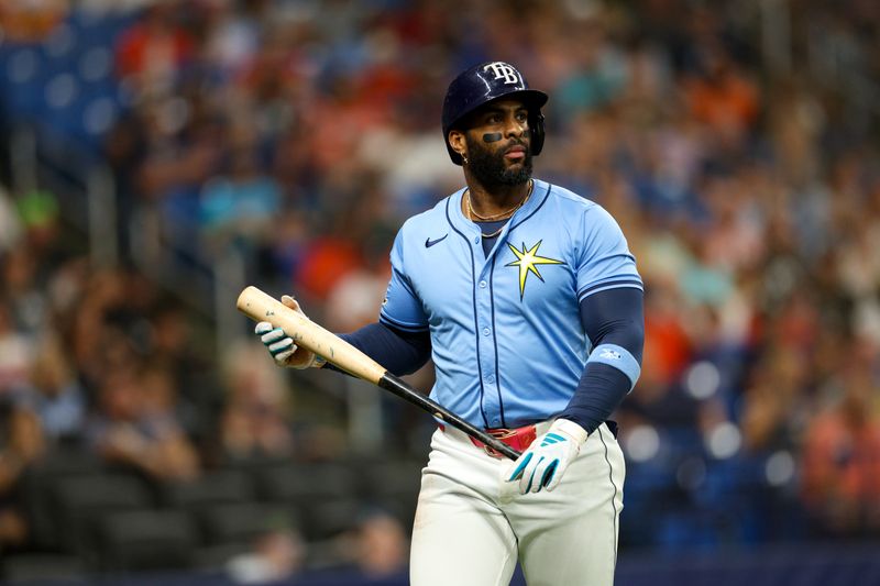 Aug 12, 2024; St. Petersburg, Florida, USA; Tampa Bay Rays first baseman Yandy Diaz (2) reacts after striking out against the Houston Astros in the first inning at Tropicana Field. Mandatory Credit: Nathan Ray Seebeck-USA TODAY Sports