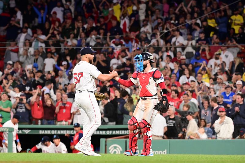 Jun 16, 2024; Boston, Massachusetts, USA; Boston Red Sox relief pitcher Greg Weissert (57) and catcher Connor Wong (12) celebrate beating the New York Yankees at Fenway Park. Mandatory Credit: Eric Canha-USA TODAY Sports