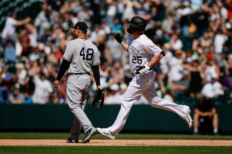 Jul 16, 2023; Denver, Colorado, USA; Colorado Rockies designated hitter C.J. Cron (25) gestures as he rounds the bases on a grand slam in the eighth inning against the New York Yankees at Coors Field. Mandatory Credit: Isaiah J. Downing-USA TODAY Sports