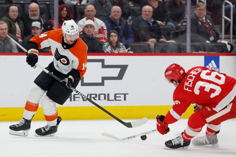 Jan 25, 2024; Detroit, Michigan, USA;  Philadelphia Flyers center Sean Couturier (14) skates with the puck defended by Detroit Red Wings right wing Christian Fischer (36) in the third period at Little Caesars Arena. Mandatory Credit: Rick Osentoski-USA TODAY Sports