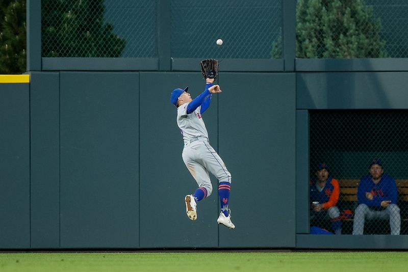 May 26, 2023; Denver, Colorado, USA; New York Mets center fielder Brandon Nimmo (9) leaps to make a catch in the fifth inning against the Colorado Rockies at Coors Field. Mandatory Credit: Isaiah J. Downing-USA TODAY Sports