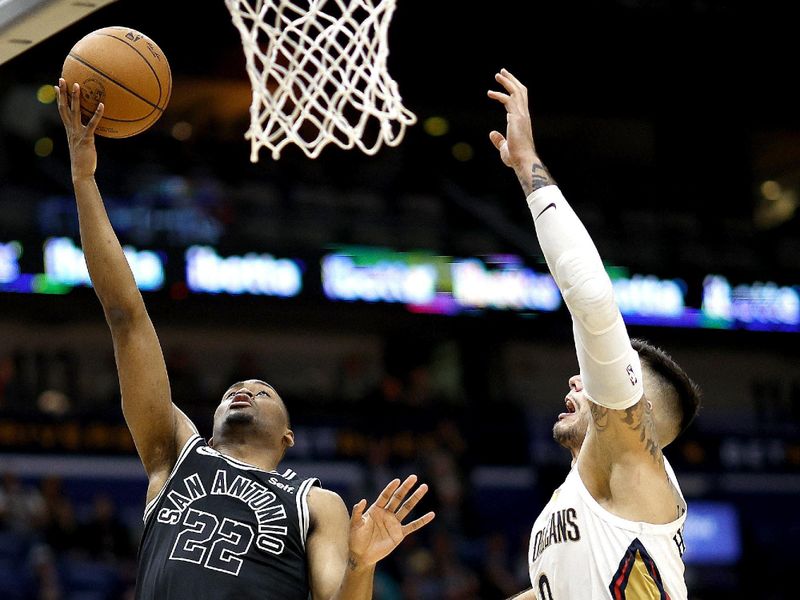 NEW ORLEANS, LOUISIANA - DECEMBER 22: Malaki Branham #22 of the San Antonio Spurs shoots over Willy Hernangomez #9 of the New Orleans Pelicans during the fourth quarter of an NBA game at Smoothie King Center on December 22, 2022 in New Orleans, Louisiana. NOTE TO USER: User expressly acknowledges and agrees that, by downloading and or using this photograph, User is consenting to the terms and conditions of the Getty Images License Agreement. (Photo by Sean Gardner/Getty Images) (Photo by Sean Gardner/Getty Images)