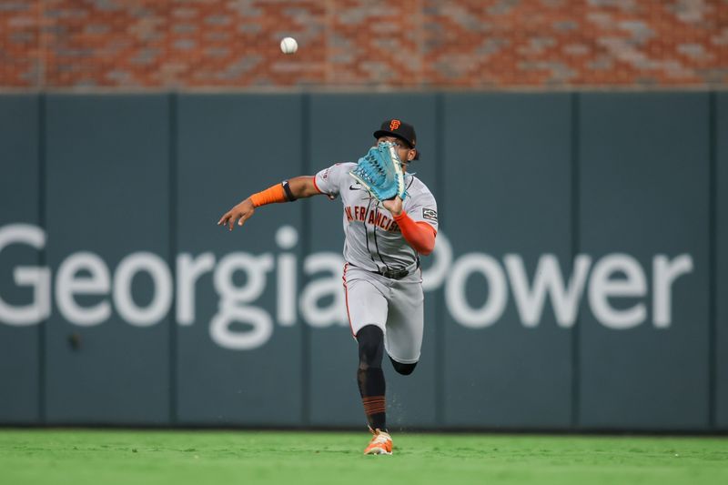 Jul 2, 2024; Atlanta, Georgia, USA; San Francisco Giants center fielder Luis Matos (29) catches a fly ball against the Atlanta Braves in the seventh inning at Truist Park. Mandatory Credit: Brett Davis-USA TODAY Sports