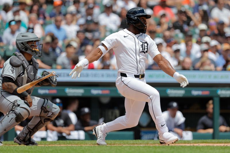 Jun 23, 2024; Detroit, Michigan, USA;  Detroit Tigers center fielder Akil Baddoo (60) hits a two-run home run in the first inning against the Chicago White Sox at Comerica Park. Mandatory Credit: Rick Osentoski-USA TODAY Sports