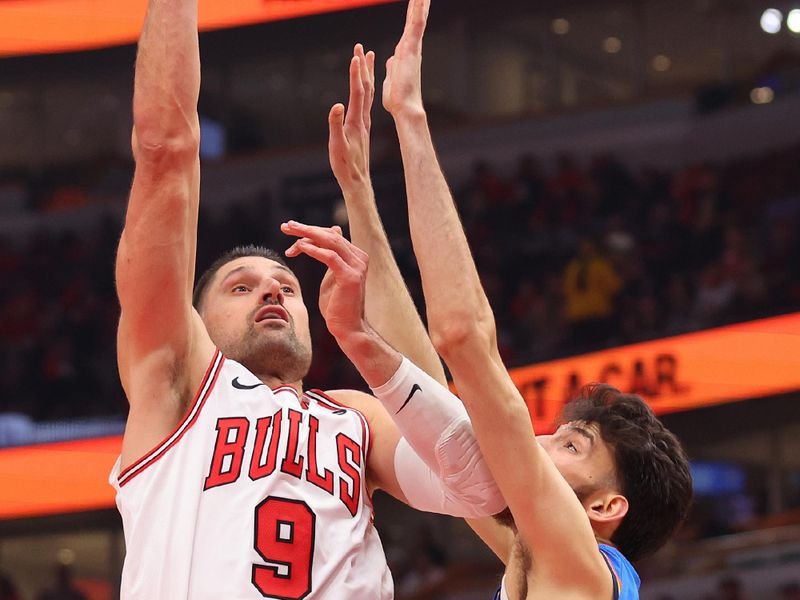 CHICAGO, ILLINOIS - OCTOBER 25: Nikola Vucevic #9 of the Chicago Bulls shoots over Chet Holmgren #7 of the Oklahoma City Thunder during the second half at the United Center on October 25, 2023 in Chicago, Illinois. NOTE TO USER: User expressly acknowledges and agrees that, by downloading and or using this photograph, User is consenting to the terms and conditions of the Getty Images License Agreement. (Photo by Michael Reaves/Getty Images)