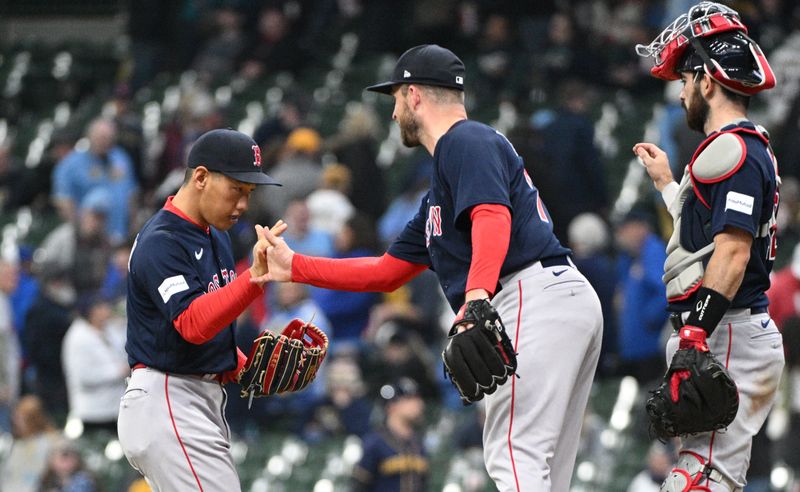 Apr 23, 2023; Milwaukee, Wisconsin, USA; Boston Red Sox left fielder Masataka Yoshida (7) and Boston Red Sox relief pitcher Ryan Brasier (70) celebrate a 12-5 win over the Milwaukee Brewers at American Family Field. Mandatory Credit: Michael McLoone-USA TODAY Sports