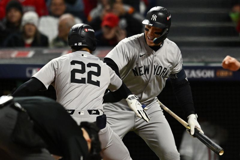 Oct 18, 2024; Cleveland, Ohio, USA; New York Yankees outfielder Juan Soto (22) celebrates with outfielder Aaron Judge (99) after hitting a two run home run against the Cleveland Guardians in the first inning during game four of the ALCS for the 2024 MLB playoffs at Progressive Field. Mandatory Credit: Ken Blaze-Imagn Images