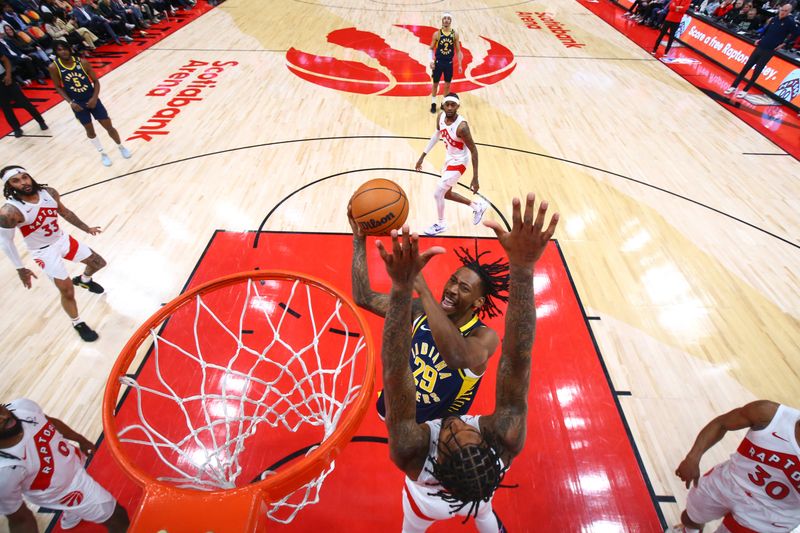TORONTO, CANADA - APRIL 9: Quenton Jackson #29 of the Indiana Pacers goes to the basket during the game on April 9, 2024 at the Scotiabank Arena in Toronto, Ontario, Canada.  NOTE TO USER: User expressly acknowledges and agrees that, by downloading and or using this Photograph, user is consenting to the terms and conditions of the Getty Images License Agreement.  Mandatory Copyright Notice: Copyright 2024 NBAE (Photo by Vaughn Ridley/NBAE via Getty Images)
