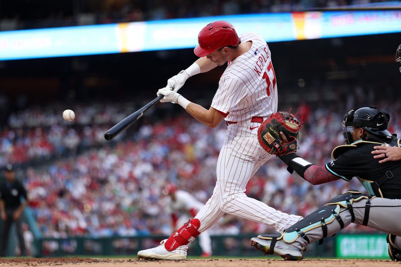 May 3, 2025; Philadelphia, Pennsylvania, USA; Philadelphia Phillies outfielder Max Kepler (17) hits a two RBI home run against the Arizona Diamondbacks during the twenty-second inning at Citizens Bank Park. Mandatory Credit: Bill Streicher-Imagn Images