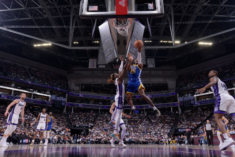 SACRAMENTO, CA - APRIL 16: Jonathan Kuminga #00 of the Golden State Warriors drives to the basket during the game against the Sacramento Kings during the 2024 Play-In Tournament on April 16, 2024 at Golden 1 Center in Sacramento, California. NOTE TO USER: User expressly acknowledges and agrees that, by downloading and or using this Photograph, user is consenting to the terms and conditions of the Getty Images License Agreement. Mandatory Copyright Notice: Copyright 2024 NBAE (Photo by Rocky Widner/NBAE via Getty Images)