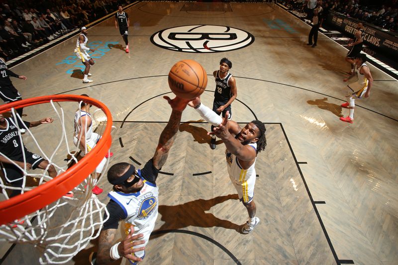 BROOKLYN, NY - MARCH 6: Gary Payton II #0 of the Golden State Warriors rebounds during the game against the Brooklyn Nets on March 6, 2025 at Barclays Center in Brooklyn, New York. NOTE TO USER: User expressly acknowledges and agrees that, by downloading and or using this Photograph, user is consenting to the terms and conditions of the Getty Images License Agreement. Mandatory Copyright Notice: Copyright 2025 NBAE(Photo by Nathaniel S. Butler/NBAE via Getty Images)