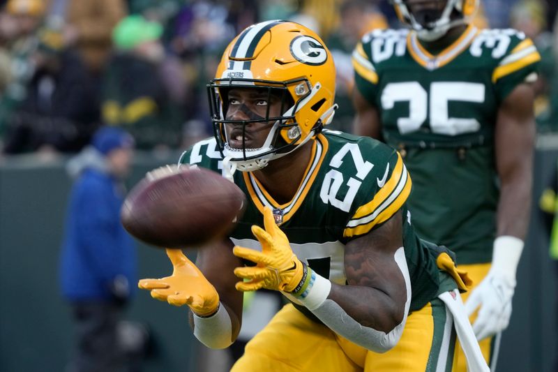 Green Bay Packers running back Patrick Taylor (27) warms up before an NFL football game against the Minnesota Vikings, Sunday, Jan. 1, 2023, in Green Bay, Wis. (AP Photo/Morry Gash)