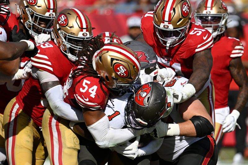 Tampa Bay Buccaneers running back Rachaad White (1) is tackled against the San Francisco 49ers during the second half of an NFL football game in Tampa, Fla., Sunday, Nov. 10, 2024. (AP Photo/Jason Behnken)