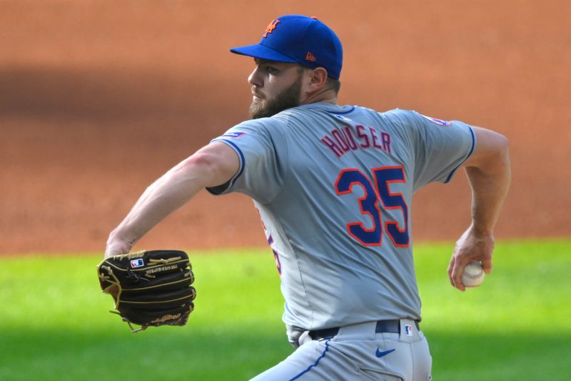 May 21, 2024; Cleveland, Ohio, USA; New York Mets starting pitcher Adrian Houser (35) delivers a pitch in the first inning against the Cleveland Guardians at Progressive Field. Mandatory Credit: David Richard-USA TODAY Sports