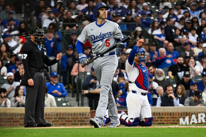 Apr 22, 2025; Chicago, Illinois, USA; Los Angeles Dodgers first base Freddie Freeman (5) strikes out swinging against the Chicago Cubs during the first inning at Wrigley Field. Mandatory Credit: Matt Marton-Imagn Images