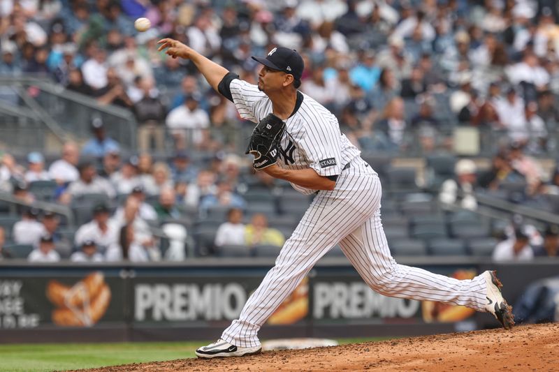 May 4, 2025; Bronx, New York, USA; New York Yankees starting pitcher Carlos Carrasco (59) delivers a pitch during the seventh inning against the Tampa Bay Rays at Yankee Stadium. Mandatory Credit: Vincent Carchietta-Imagn Images