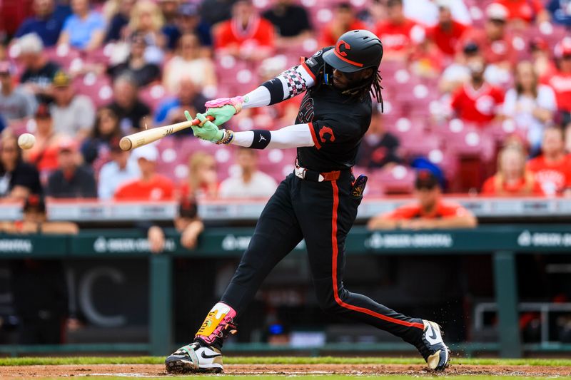 May 16, 2025; Cincinnati, Ohio, USA; Cincinnati Reds shortstop Elly De La Cruz (44) hits a single in the first inning against the Cleveland Guardians at Great American Ball Park. Mandatory Credit: Katie Stratman-Imagn Images