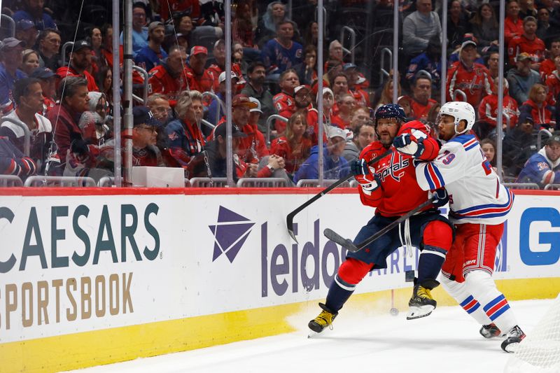 Oct 29, 2024; Washington, District of Columbia, USA; New York Rangers defenseman K'Andre Miller (79) checks Washington Capitals left wing Alex Ovechkin (8) in the third period  at Capital One Arena. Mandatory Credit: Geoff Burke-Imagn Images