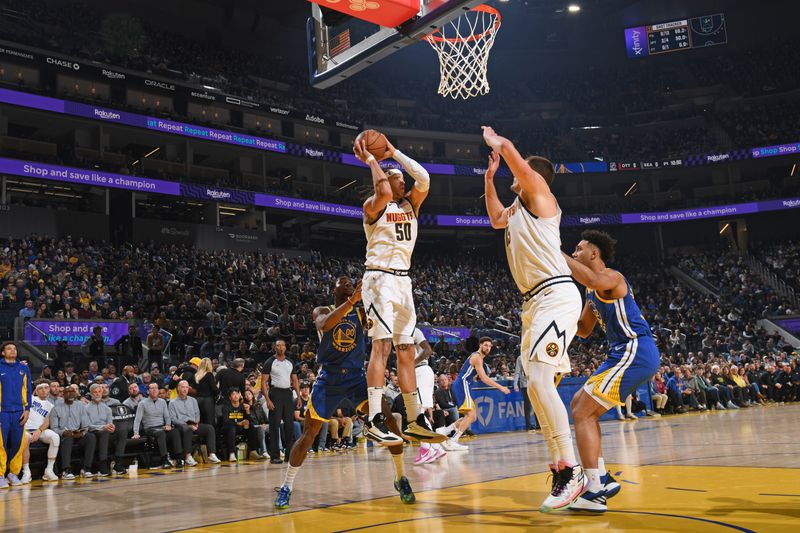 SAN FRANCISCO, CA - JANUARY 4: Aaron Gordon #50 of the Denver Nuggets rebounds the ball during the game against the Golden State Warriors on January 4, 2024 at Chase Center in San Francisco, California. NOTE TO USER: User expressly acknowledges and agrees that, by downloading and or using this photograph, user is consenting to the terms and conditions of Getty Images License Agreement. Mandatory Copyright Notice: Copyright 2024 NBAE (Photo by Noah Graham/NBAE via Getty Images)