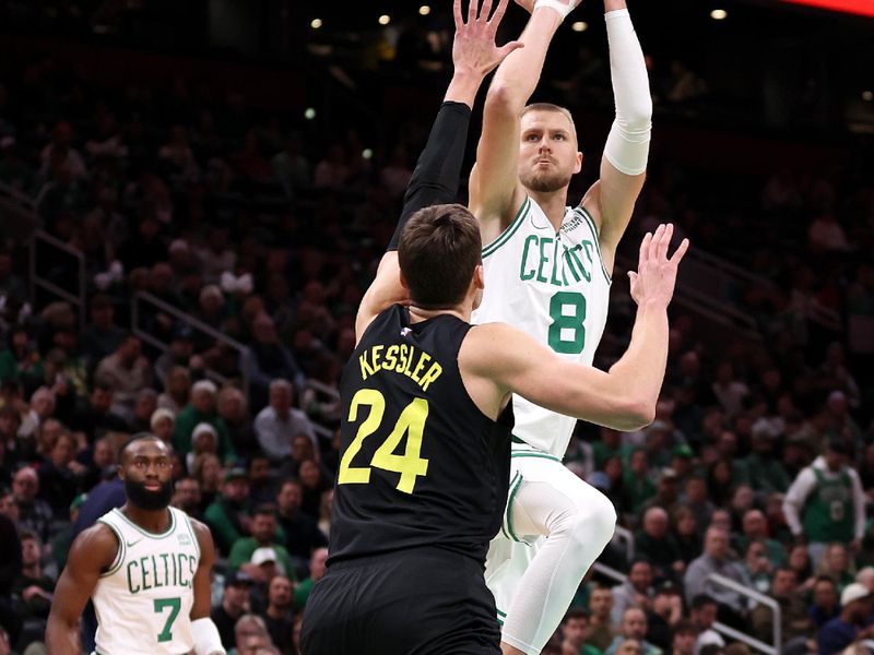 BOSTON, MASSACHUSETTS - JANUARY 05: Kristaps Porzingis #8 of the Boston Celtics takes a shot over Walker Kessler #24 of the Utah Jazz during the second quarter at TD Garden on January 05, 2024 in Boston, Massachusetts. NOTE TO USER: User expressly acknowledges and agrees that, by downloading and or using this photograph, user is consenting to the terms and conditions of the Getty Images License Agreement.  (Photo by Maddie Meyer/Getty Images)