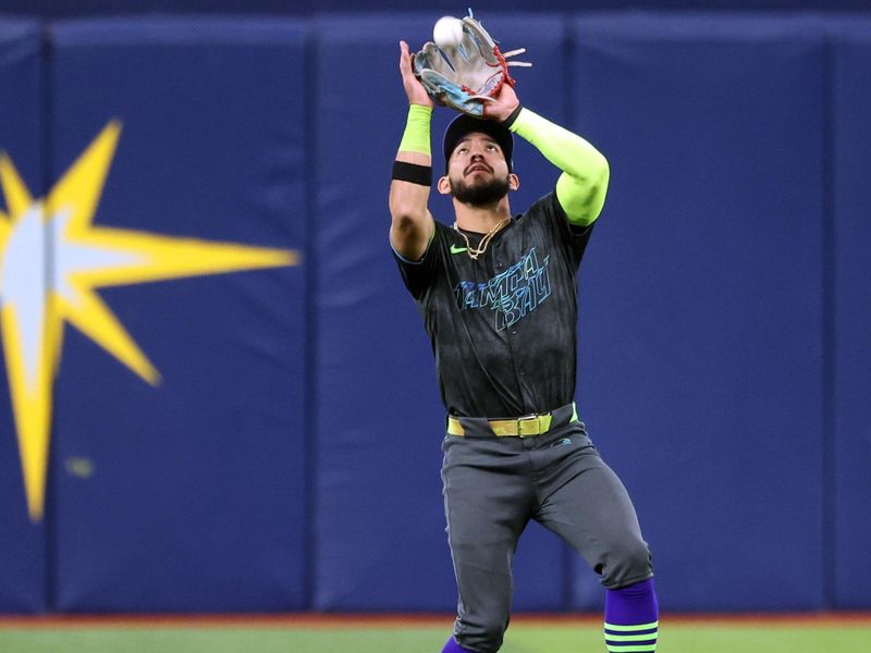 May 8, 2024; St. Petersburg, Florida, USA;  Tampa Bay Rays shortstop Jose Caballero (7) catches a fly ball against the Chicago White Sox during the third inning at Tropicana Field. Mandatory Credit: Kim Klement Neitzel-USA TODAY Sports