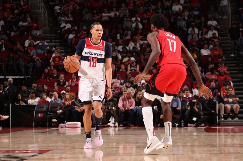 HOUSTON, TX - NOVEMBER 11: Kyshawn George #18 of the Washington Wizards dribbles the ball during the game against the Houston Rockets on November 11, 2024 at the Toyota Center in Houston, Texas. NOTE TO USER: User expressly acknowledges and agrees that, by downloading and or using this photograph, User is consenting to the terms and conditions of the Getty Images License Agreement. Mandatory Copyright Notice: Copyright 2024 NBAE (Photo by KeShawn Ennis/NBAE via Getty Images)