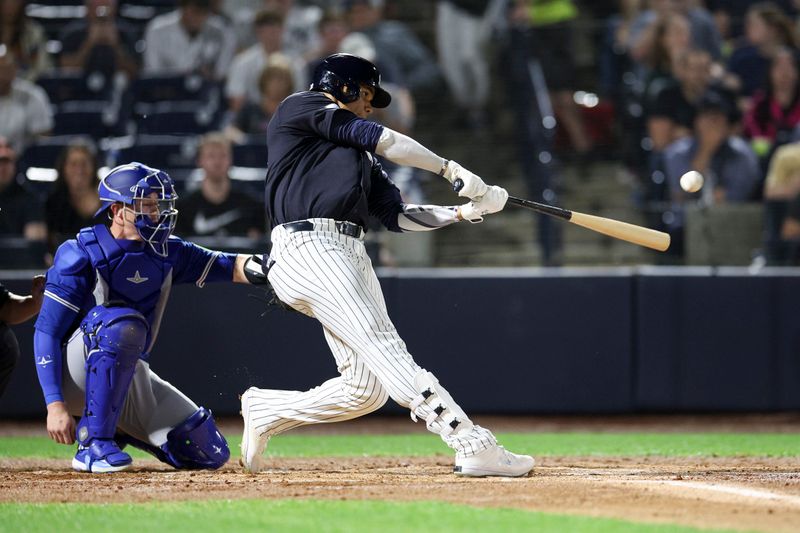 Mar 1, 2024; Tampa, Florida, USA;  New York Yankees right fielder Juan Soto (22) doubles against the Toronto Blue Jays in the first inning at George M. Steinbrenner Field. Mandatory Credit: Nathan Ray Seebeck-USA TODAY Sports