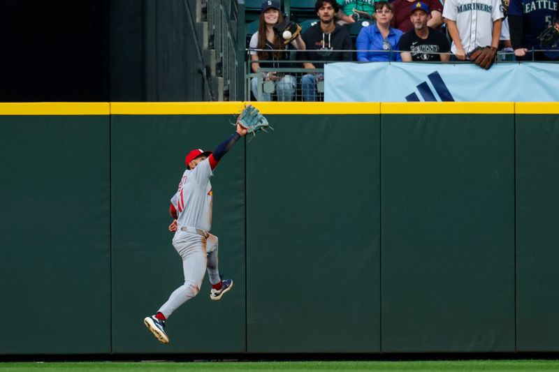 Sep 9, 2025; Seattle, Washington, USA; St. Louis Cardinals center fielder Victor Scott II (11) catches a line drive against the Seattle Mariners during the second inning at T-Mobile Park. Mandatory Credit: Joe Nicholson-Imagn Images