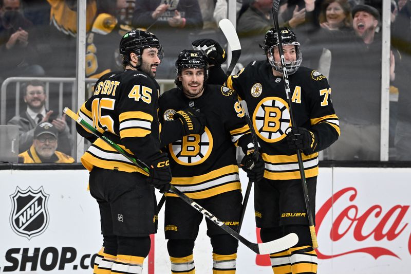 Jan 15, 2026; Boston, Massachusetts, USA; Boston Bruins center Marat Khusnutdinov (92) celebrates his goal against the Seattle Kraken with defenseman Jonathan Aspirot (45) and defenseman Charlie McAvoy (73) during the first period at TD Garden. Mandatory Credit: Eric Canha-Imagn Images
