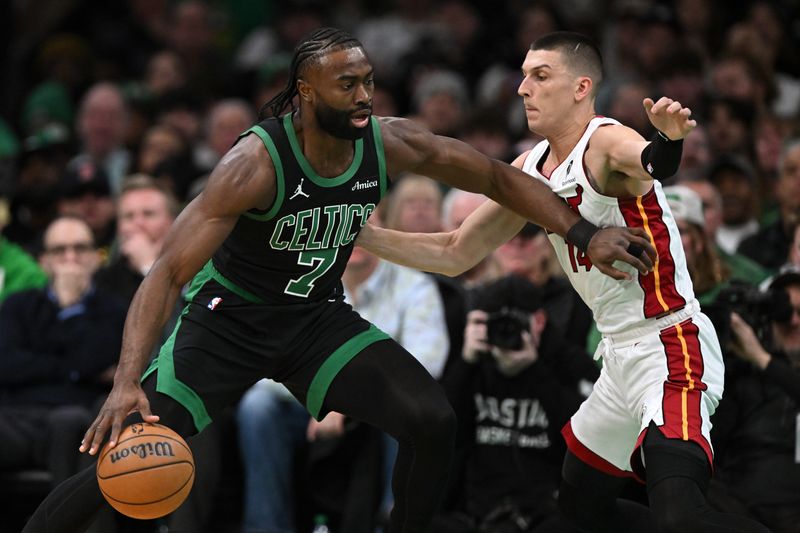 BOSTON, MASSACHUSETTS - DECEMBER 02: Jaylen Brown #7 of the Boston Celtics dribbles the ball to the basket against Tyler Herro #14 of the Miami Heat during the first quarter at the TD Garden on December 02, 2024 in Boston, Massachusetts. NOTE TO USER: User expressly acknowledges and agrees that, by downloading and or using this photograph, User is consenting to the terms and conditions of the Getty Images License Agreement. (Photo by Brian Fluharty/Getty Images)