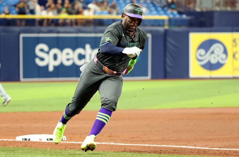 May 8, 2024; St. Petersburg, Florida, USA;  Tampa Bay Rays first base Yandy Díaz (2) runs home to score a run against the Chicago White Sox during the fourth inning at Tropicana Field. Mandatory Credit: Kim Klement Neitzel-USA TODAY Sports