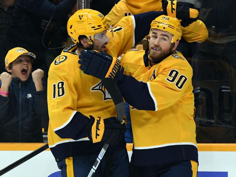 Dec 2, 2023; Nashville, Tennessee, USA; Nashville Predators center Ryan O'Reilly (90) and center Liam Foudy (18) celebrate after a goal against the New York Rangers during the first period at Bridgestone Arena. Mandatory Credit: Christopher Hanewinckel-USA TODAY Sports