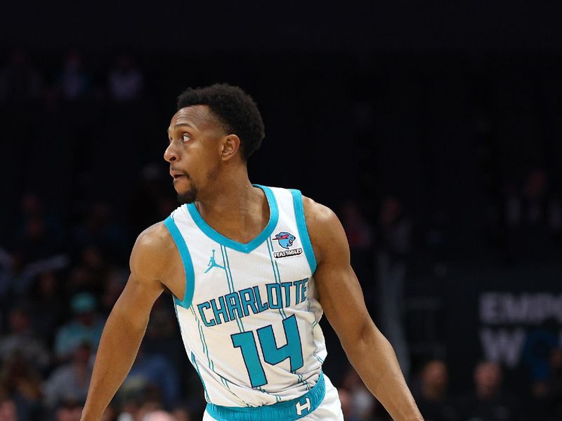 CHARLOTTE, NORTH CAROLINA - FEBRUARY 07: Ish Smith #14 of the Charlotte Hornets dribbles during the second half of the game against the Toronto Raptors at Spectrum Center on February 07, 2024 in Charlotte, North Carolina. NOTE TO USER: User expressly acknowledges and agrees that, by downloading and or using this photograph, User is consenting to the terms and conditions of the Getty Images License Agreement. (Photo by Jared C. Tilton/Getty Images)