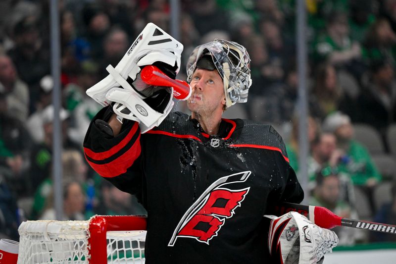 Jan 25, 2023; Dallas, Texas, USA; Carolina Hurricanes goaltender Antti Raanta (32) drinks from his water bottle before the second period against the Dallas Stars at the American Airlines Center. Mandatory Credit: Jerome Miron-USA TODAY Sports