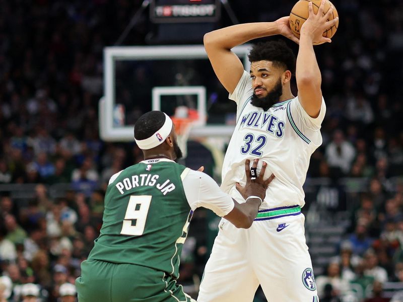 MILWAUKEE, WISCONSIN - FEBRUARY 08: Karl-Anthony Towns #32 of the Minnesota Timberwolves is defended by Bobby Portis #9 of the Milwaukee Bucks during a game at Fiserv Forum on February 08, 2024 in Milwaukee, Wisconsin. NOTE TO USER: User expressly acknowledges and agrees that, by downloading and or using this photograph, User is consenting to the terms and conditions of the Getty Images License Agreement. (Photo by Stacy Revere/Getty Images)