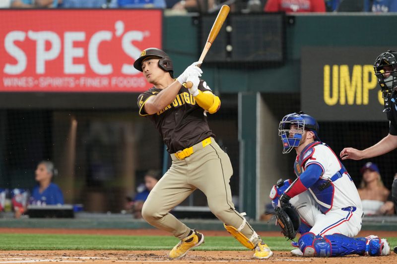 Jul 3, 2024; Arlington, Texas, USA; San Diego Padres shortstop Ha-Seong Kim (7) follows through on his single against the Texas Rangers during the second inning at Globe Life Field. Mandatory Credit: Jim Cowsert-USA TODAY Sports