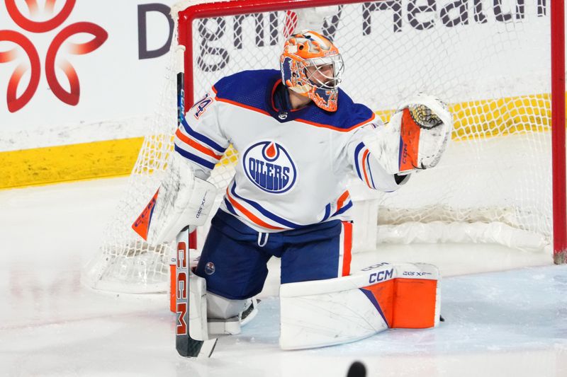 Feb 19, 2024; Tempe, Arizona, USA; Edmonton Oilers goaltender Stuart Skinner (74) makes a save against the Arizona Coyotes during the third period at Mullett Arena. Mandatory Credit: Joe Camporeale-USA TODAY Sports