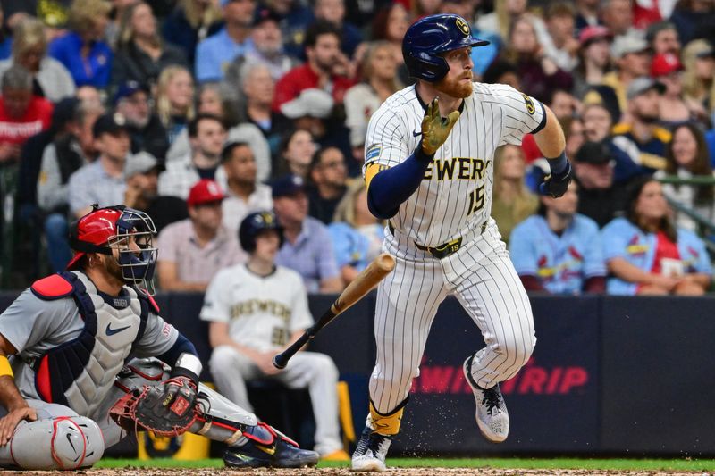 May 11, 2024; Milwaukee, Wisconsin, USA; Milwaukee Brewers third baseman Oliver Dunn (15) hits a double against the St. Louis Cardinals in the third inning at American Family Field. Mandatory Credit: Benny Sieu-USA TODAY Sports