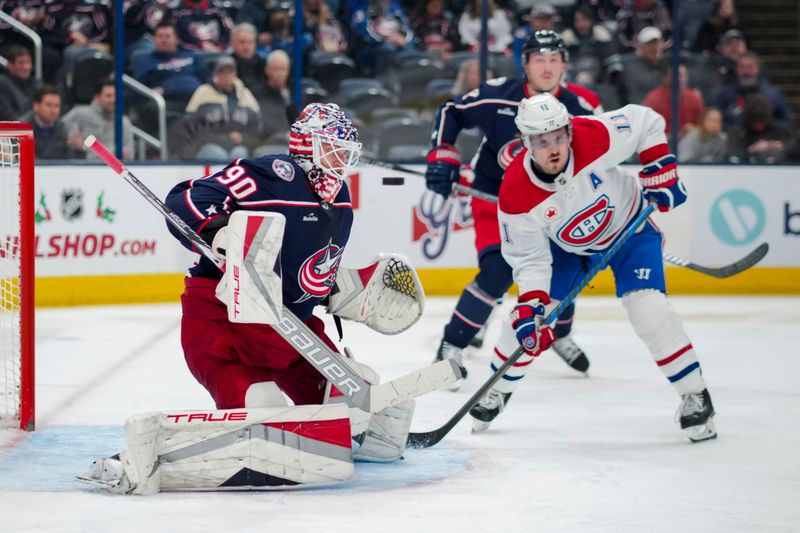 Nov 29, 2023; Columbus, Ohio, USA;  Columbus Blue Jackets goaltender Elvis Merzlikins (90) makes a save in net against the Montreal Canadiens in the third period at Nationwide Arena. Mandatory Credit: Aaron Doster-USA TODAY Sports