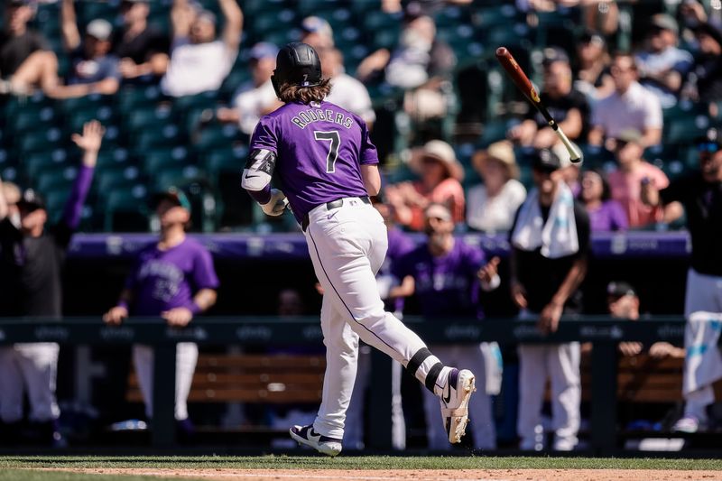 Aug 29, 2024; Denver, Colorado, USA; Colorado Rockies second baseman Brendan Rodgers (7) tosses his bat on a two run home run in the fourth inning against the Miami Marlins at Coors Field. Mandatory Credit: Isaiah J. Downing-USA TODAY Sports