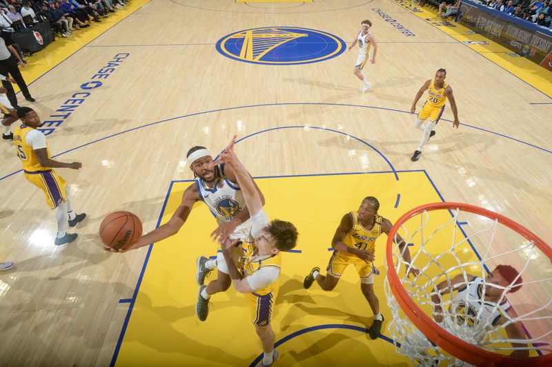 SAN FRANCISCO, CA - OCTOBER 18: Moses Moody #4 of the Golden State Warriors drives to the basket during the game against the Los Angeles Lakers during a NBA Preseason game on October 18, 2024 at Chase Center in San Francisco, California. NOTE TO USER: User expressly acknowledges and agrees that, by downloading and or using this photograph, user is consenting to the terms and conditions of Getty Images License Agreement. Mandatory Copyright Notice: Copyright 2024 NBAE (Photo by Noah Graham/NBAE via Getty Images)