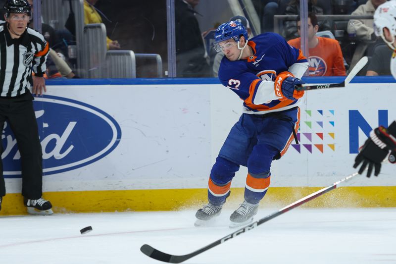 Apr 2, 2024; Elmont, New York, USA; New York Islanders center Mathew Barzal (13) take a shot against the Chicago Blackhawks during the second period at UBS Arena. Mandatory Credit: Thomas Salus-USA TODAY Sports