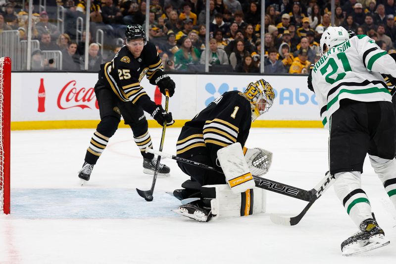 Feb 19, 2024; Boston, Massachusetts, USA; Boston Bruins defenseman Brandon Carlo (25) moves to clear a puck out of the creas that got through Boston Bruins goaltender Jeremy Swayman (1) during the second period against the Dallas Stars at TD Garden. Mandatory Credit: Winslow Townson-USA TODAY Sports