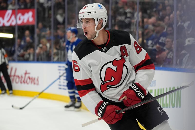 Oct 21, 2025; Toronto, Ontario, CAN; New Jersey Devils forward Jack Hughes (86) reacts after scoring against the Toronto Maple Leafs during the second period at Scotiabank Arena. Mandatory Credit: John E. Sokolowski-Imagn Images